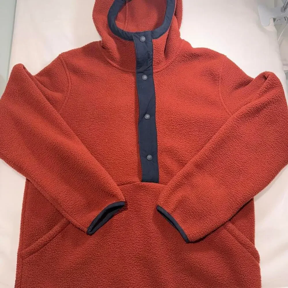 The North Face orange fleece hoodie with navy blue trim, size M